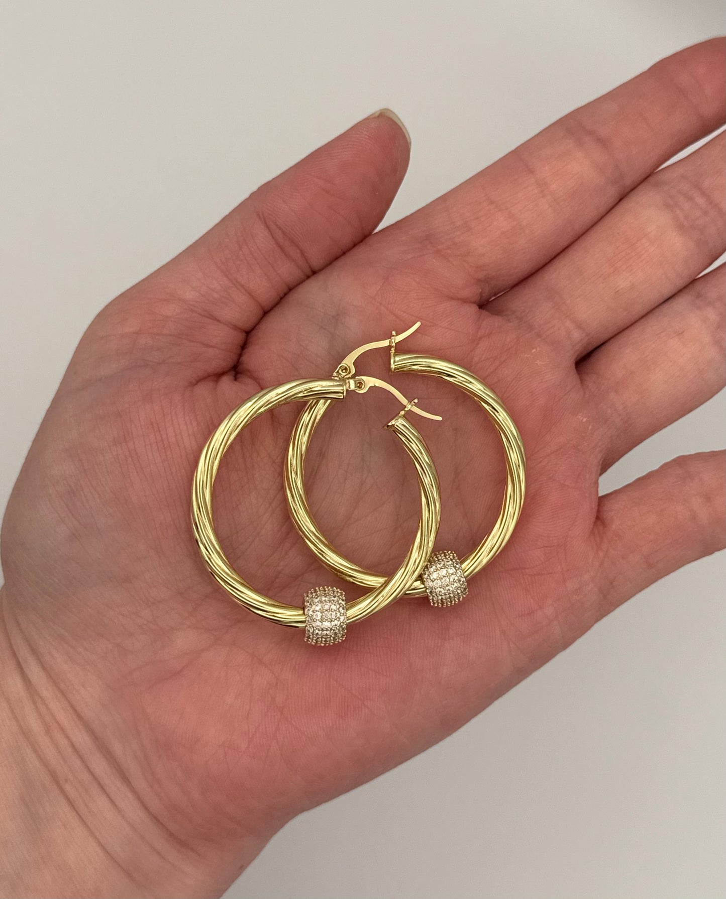Gold plated Cubic Zirconia Twisted Diamond Ball Hoop Earrings – Light Luxury with a Modern Edge
